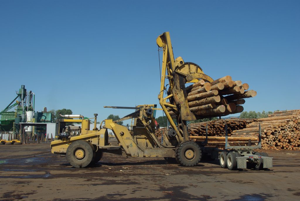 Tire ballast for log stacker